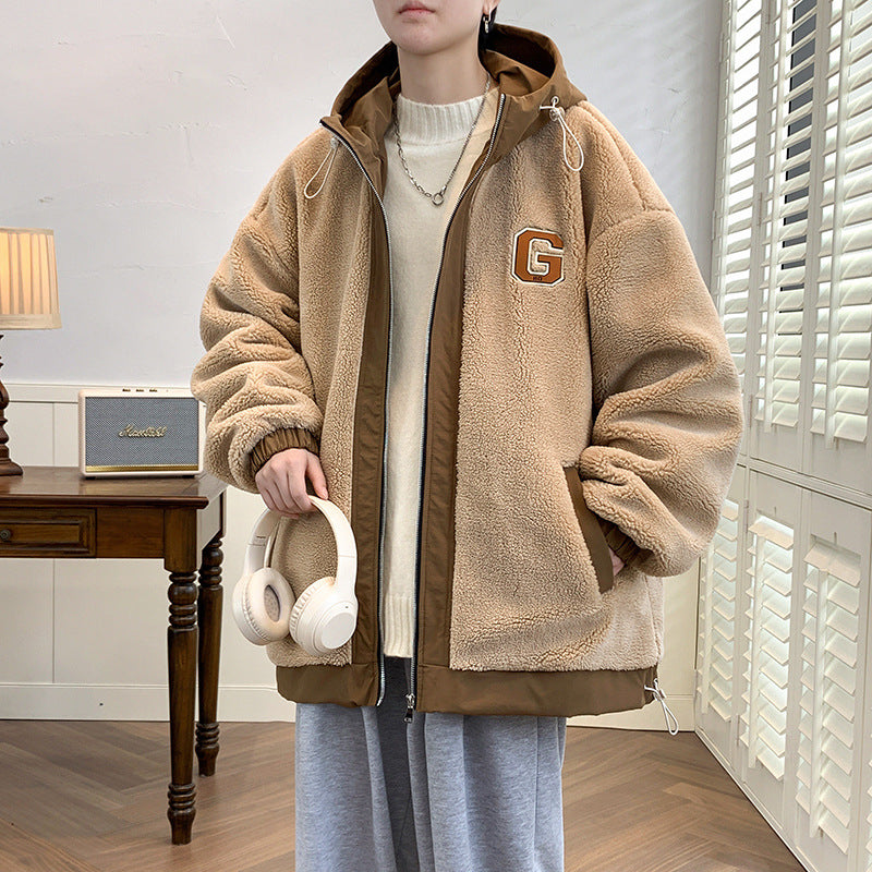 Model wearing a khaki hooded zip jacket with a G chest detail